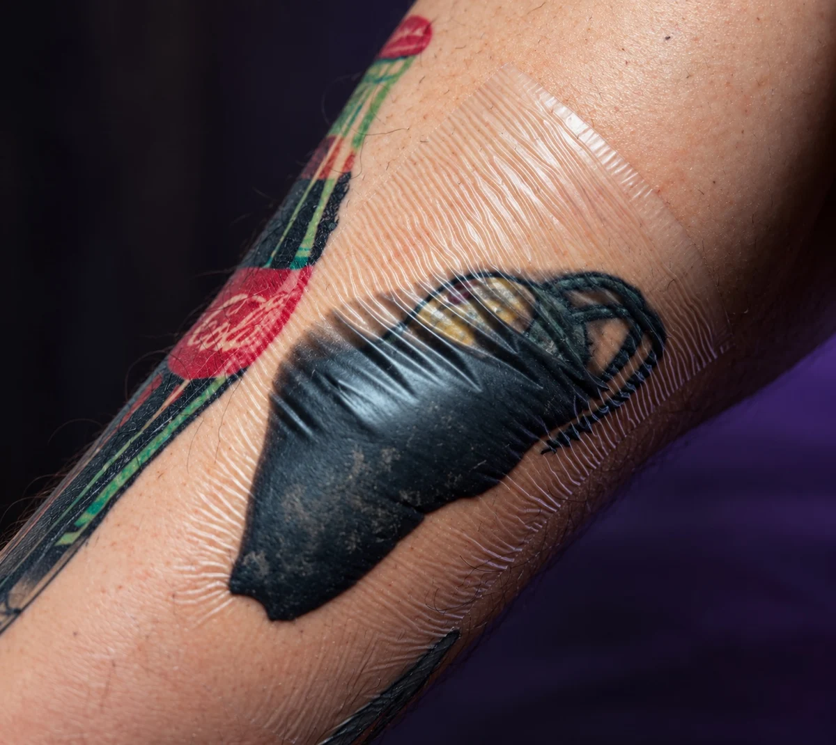 Tattoo covered with healing film