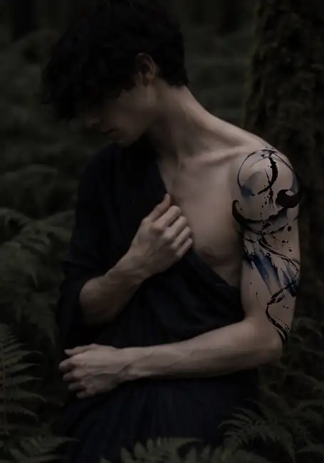 Abstract black and blue shoulder tattoo design placement mockup by Kristina Vishar